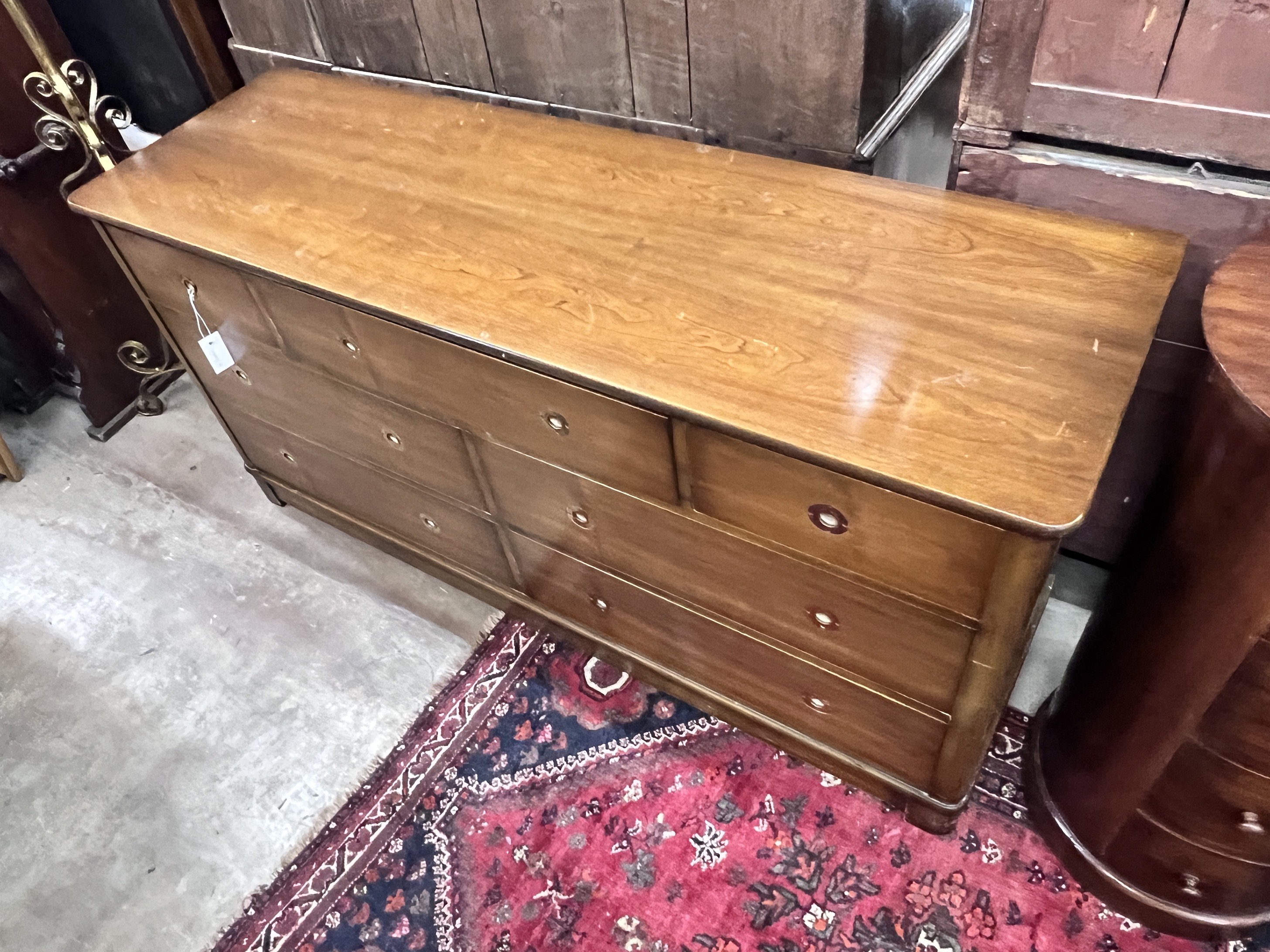 A reproduction mahogany military style dresser fitted seven small drawers, with recessed brass handles, width 153cm, depth 48cm, height 74cm